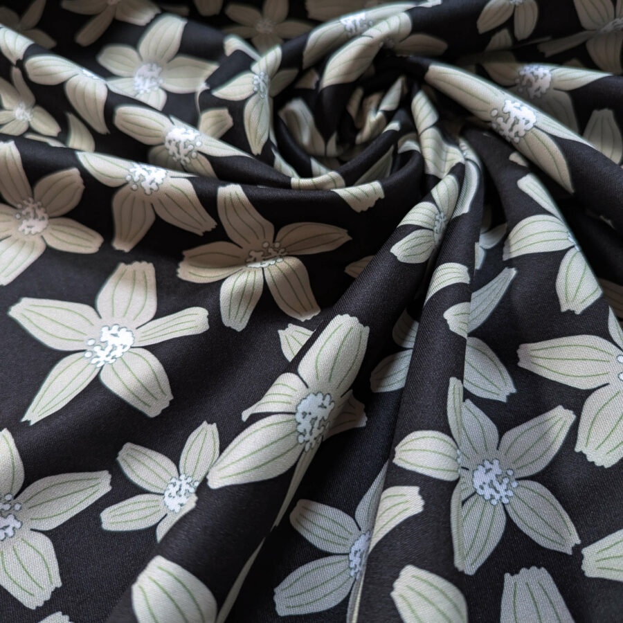 tissu fond noir fleur blanche