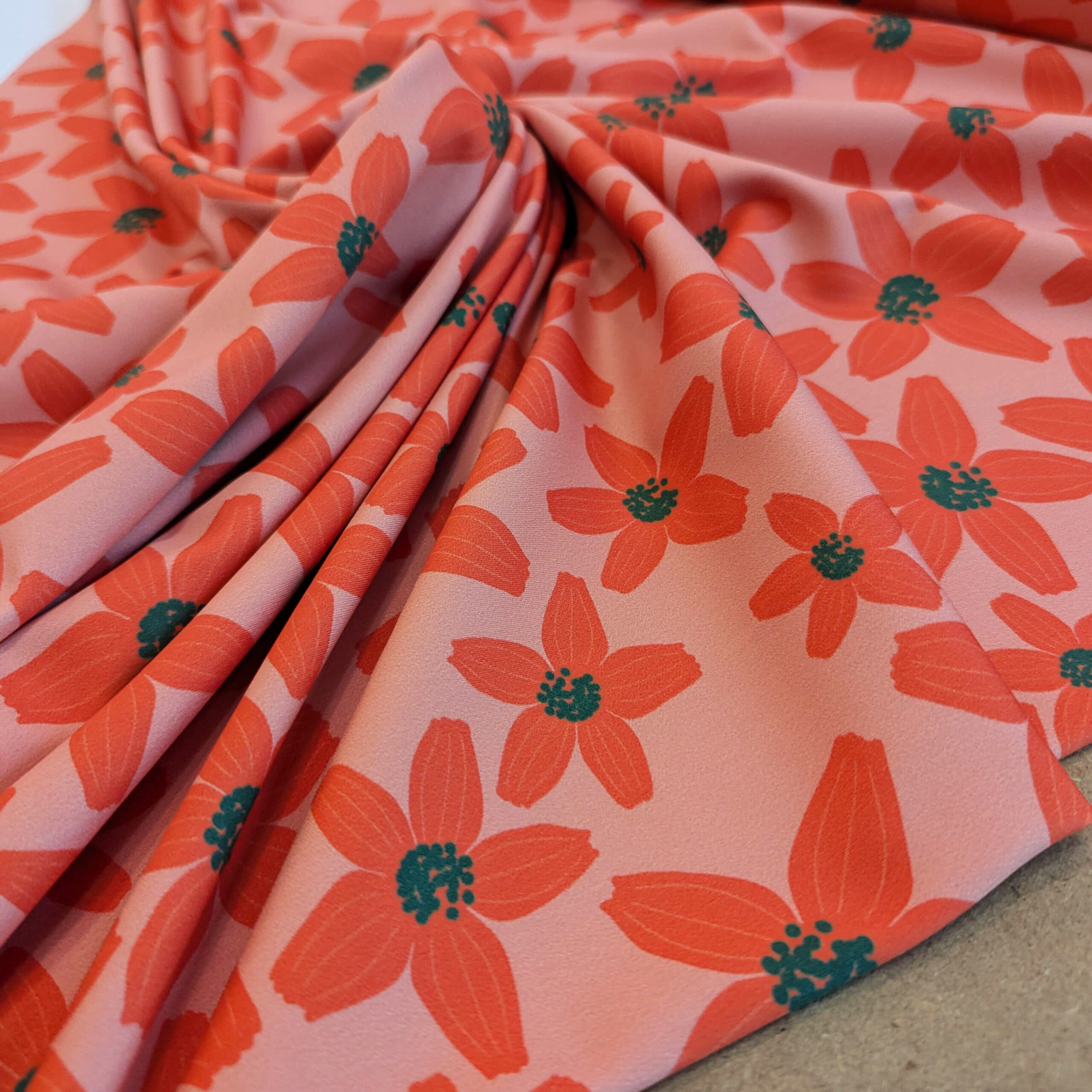 Tissu lycra orange vert fleurs